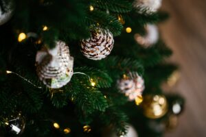 Beautifully decorated Christmas table in the living room. With the objects of holiday decor.